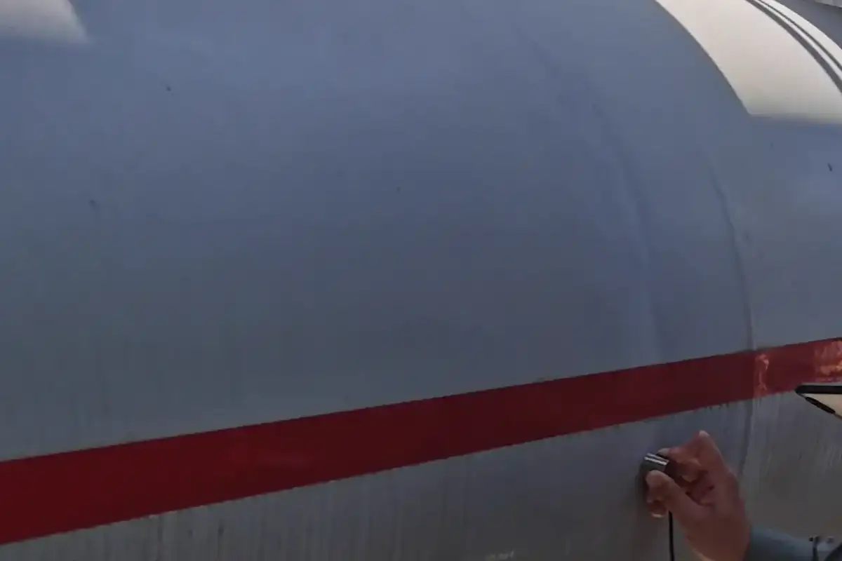 Anonymized GIS inspection position beside an insulated enclosure
