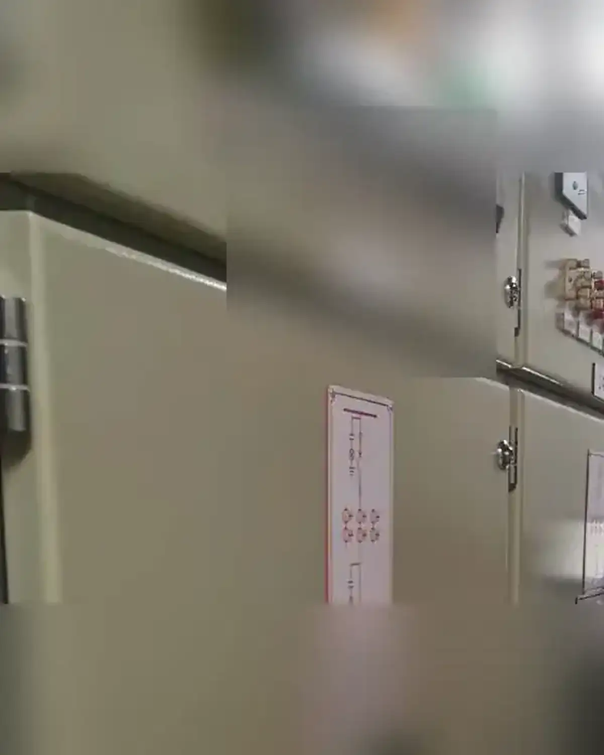 Anonymized switchgear door and control section during inspection
